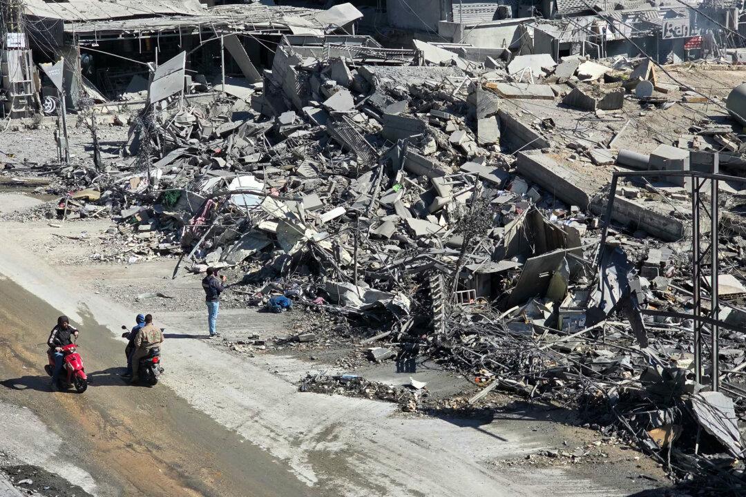 Motorists pass the rubble of destroyed buildings at the site of an Israeli airstrike in the southern Lebanese city of Nabatieh on March 5, 2026. Israel also launched a fresh wave of strikes on Iran, which stepped up its attacks on Gulf nations Qatar and Bahrain. (Mouhammad Al-Zanaty/AFP via Getty Images)