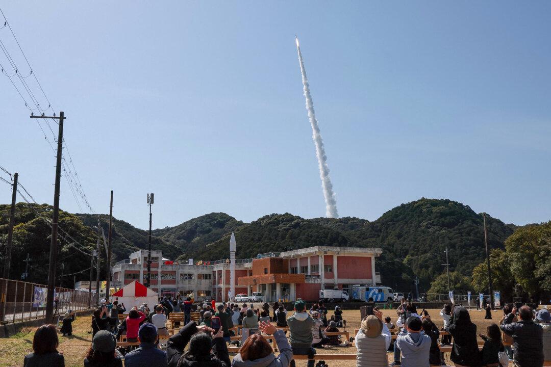 The launch scene of Kairos No. 3 is watched by people in Nachikatsuura, Japan, on March 5, 2026. A Japanese startup aiming to become the country's first private company to put a satellite into orbit said it aborted the launch of its rocket just after takeoff. (Jiji Press/AFP via Getty Images)