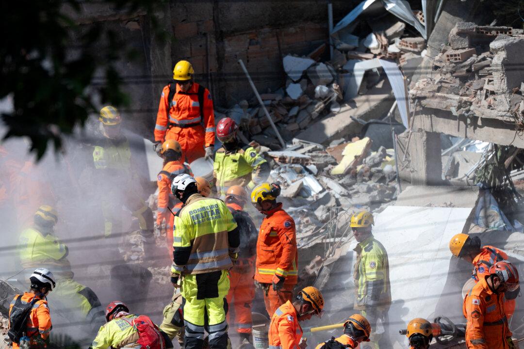 Firefighters work at a collapsed nursing home in Belo Horizonte, Minas Gerais State, Brazil, on March 5, 2026. The collapse left at least four dead, and firefighters searched the rubble for eight missing people, according to the latest tally. (Douglas Magno/AFP via Getty Images)