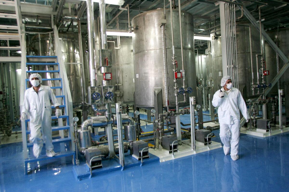Iranian technicians are seen at the Isfahan Uranium Conversion Facilities (UCF), 420 kms south of Tehran, on Aug. 8, 2005. (Behrouz Mehri/AFP via Getty Images)