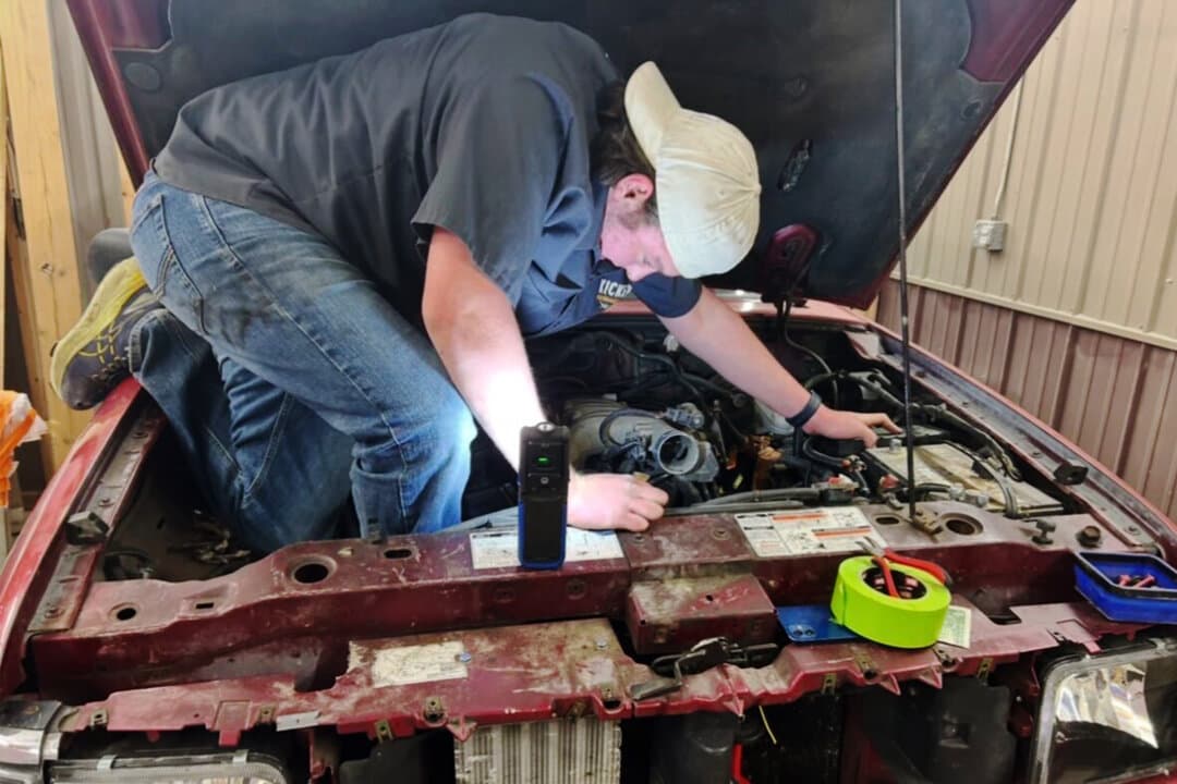 Isaac Rodden working on his car. (Courtesy of Heather Rodden)
