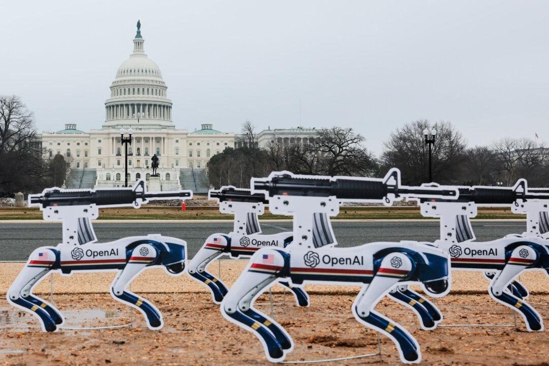 AI robot signs are planted into the ground on the National Mall in an act of protest in Washington on March 6, 2026. The signs are protesting OpenAI’s decision to allow the Pentagon to use its AI technologies. (Heather Diehl/Getty Images)