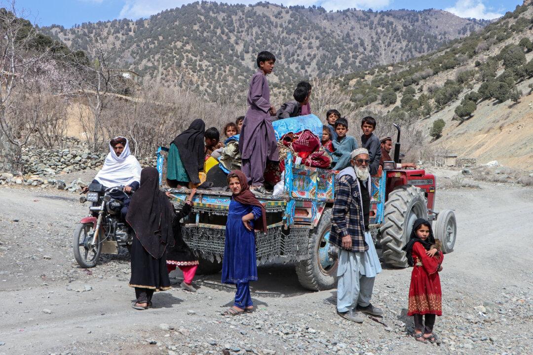 Afghan families escape amid the ongoing clashes between Pakistani forces and Taliban security personnel in the Samkani district, Afghanistan, on March 6, 2026. The United Nations rights chief said 56 Afghan civilians—nearly half of them children—had been killed since hostilities with neighboring Pakistan intensified last week. (AFP via Getty Images)