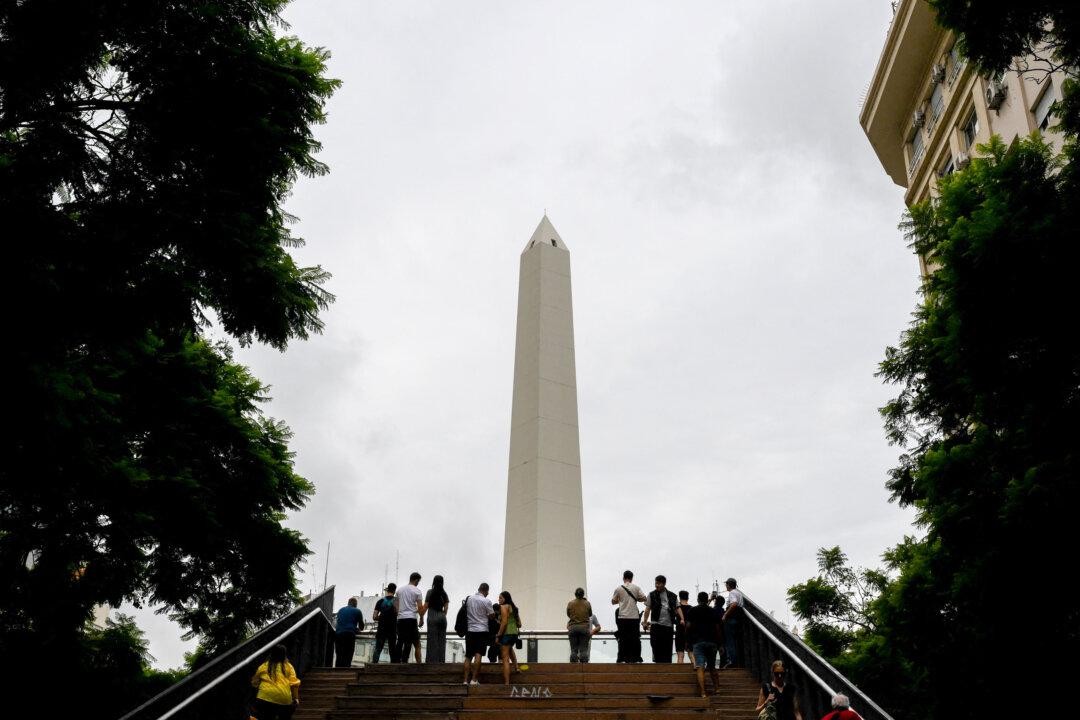 Tourists look at the Obelisk in Buenos Aires, Argentina, on March 6, 2026. (Luis Robayo/AFP via Getty Images)