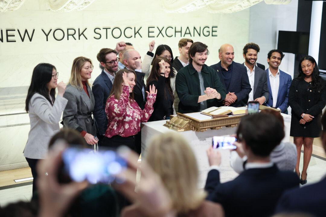 Vlad Tenev, chairman and CEO of Robinhood Markets, (C) takes photos at the New York Stock Exchange during morning trading on March 6, 2026. Stocks continued to tumble with all three major indexes dipping. The Dow lost nearly 800 points at opening on a weak jobs report and rising oil prices due to concerns of the war with Iran. (Michael M. Santiago/Getty Images)