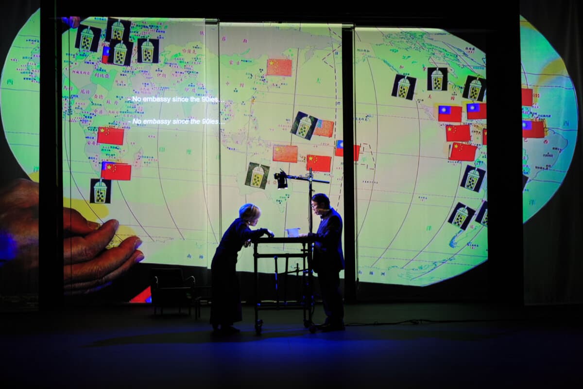 Debby Wang and David Wu in the play “This Is Not an Embassy.” (Claudia Ndebele/Courtesy of Rimini Protokoll)