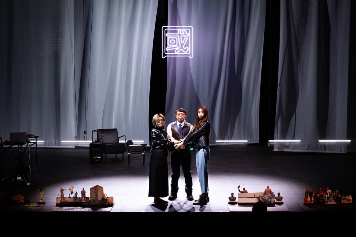 (L–R) Debby Wang, David Wu, and Kuo Chiayo in the play “This Is Not an Embassy.” (Claudia Ndebele/Courtesy of Rimini Protokoll)
