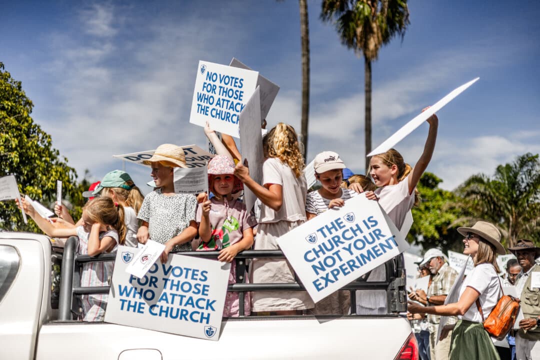 Young churchgoers hold placards during a protest march in Durban, South Africa, on March 12, 2026. The protesters demanded the protection of religious freedom, opposing the proposed measures by the Commission for the Promotion and Protection of the Rights of Cultural, Religious and Linguistic Communities to tighten oversight of churches. (Rajesh Jantilal/AFP via Getty Images)