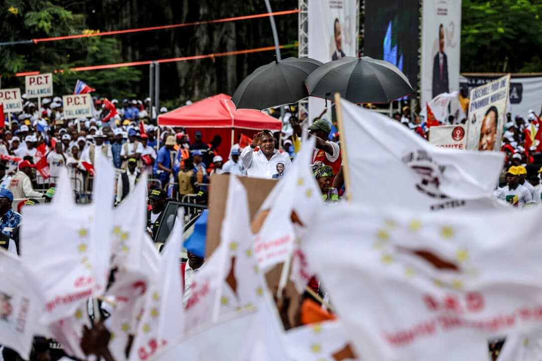Incumbent President of the Republic of Congo and presidential candidate Denis Sassou Nguesso (C) waves to supporters as he arrives at a campaign rally in Brazzaville, Congo, on March 13, 2026, ahead of Congo's presidential election scheduled for March 15, 2026. (Daniel Beloumou Olomo/AFP via Getty Images)