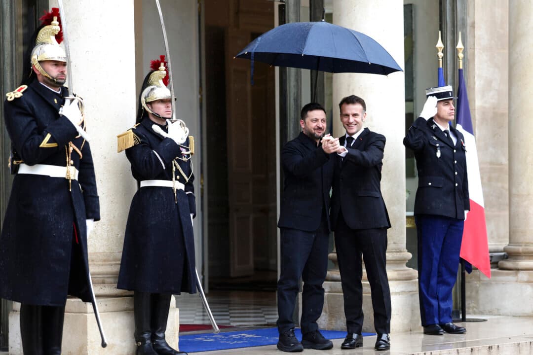 French President Emmanuel Macron (R) welcomes Ukraine's President Volodymyr Zelenskyy prior to a meeting at the Elysee Presidential Palace in Paris, on March 13, 2026. Zelenskyy has been visiting European leaders to discuss support for Ukraine and strategies for increasing pressure on Russia. (Tom Nicholson/Getty Images)
