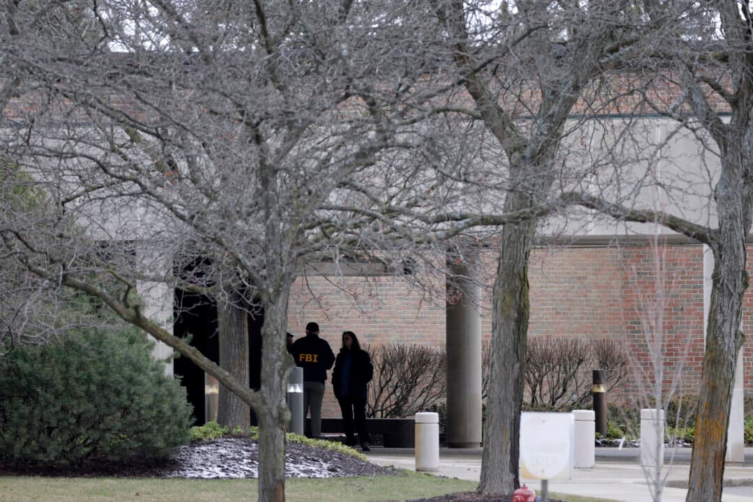 FBI agents are seen outside Temple Israel in West Bloomfield, Michigan, on March 13, 2026, after Ayman Mohamad Ghazali, 41, drove his car into the synagogue a day earlier drawing a huge police response. The driver was killed by security guards. U.S. media reported he had recently lost family members in an Israeli strike in Lebanon, as part of the ongoing Middle East war. (Jeff Kowalsky/AFP via Getty Images)