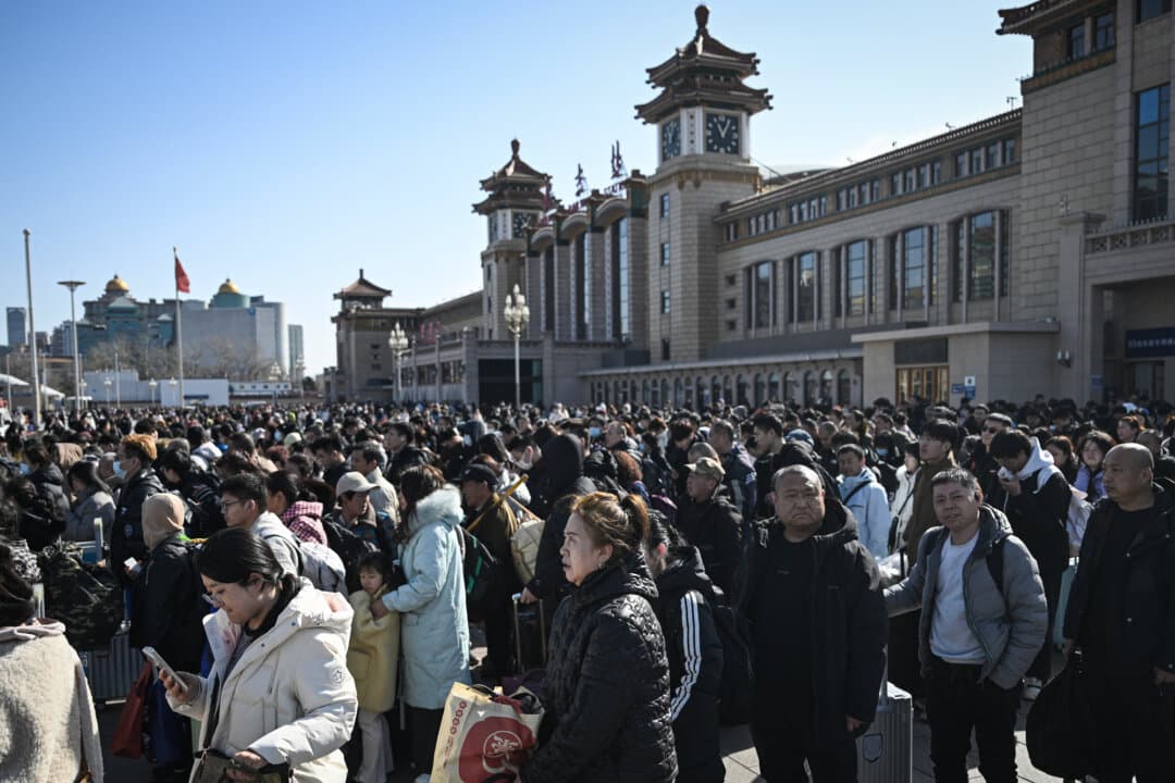 People arrive at Beijing Railway Station on Feb. 23, 2026. This was the final day of the Spring Festival holiday marking the Lunar New Year of the Horse. Local governments often resort to tax rebates on exports during the holidays to cover extra expenses and then adjust their exports later in the year, according to an expert. (Pedro Pardo / AFP via Getty Images)