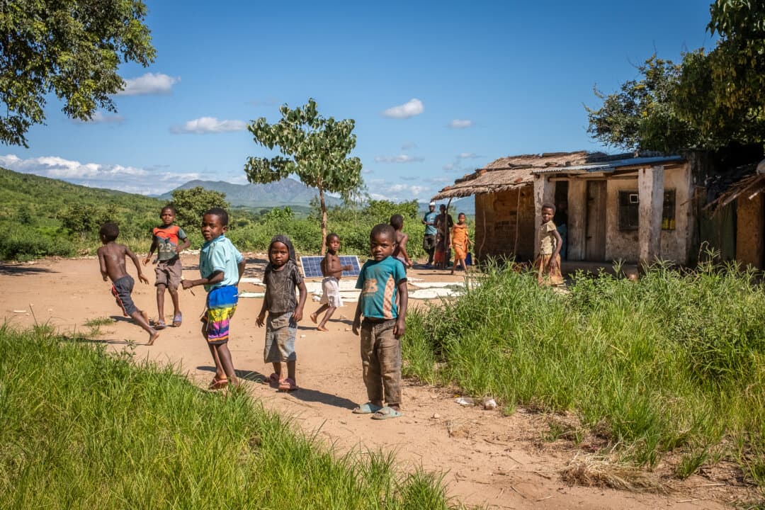 (Left) Rural villagers travel in the Mwanza district, Malawi, on Feb. 24, 2026. (Center) Children work on a farm in the Mangochi district, Malawi, on Feb. 20, 2026. (Right) Children play in a village in the Blantyre district, Malawi, on Feb. 23, 2026. (John Fredricks/The Epoch Times)