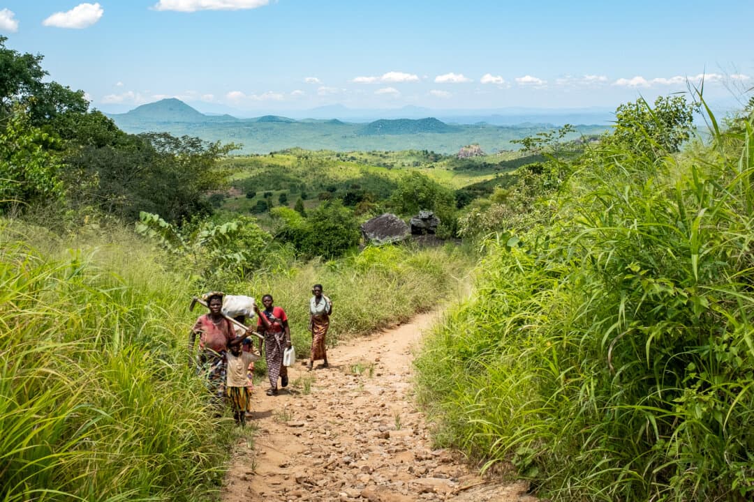 (Left) Rural villagers travel in the Mwanza district, Malawi, on Feb. 24, 2026. (Center) Children work on a farm in the Mangochi district, Malawi, on Feb. 20, 2026. (Right) Children play in a village in the Blantyre district, Malawi, on Feb. 23, 2026. (John Fredricks/The Epoch Times)