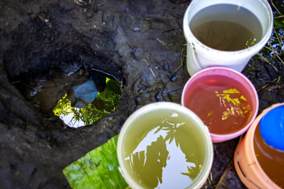 (Top, Bottom Left) Health Surveillance Officer Duncan Chikwindile examines a contaminated water source in the Blantyre district, Malawi, on Feb. 23, 2026. In addition to cholera, contaminated water can cause diseases such as diarrhea and schistosomiasis, a parasitic infection that can lead to organ damage if untreated, according to Malawian health officials. (Bottom R) People use clinic services in the Machinga district, Malawi, on Feb. 17, 2026. (John Fredricks/The Epoch Times)