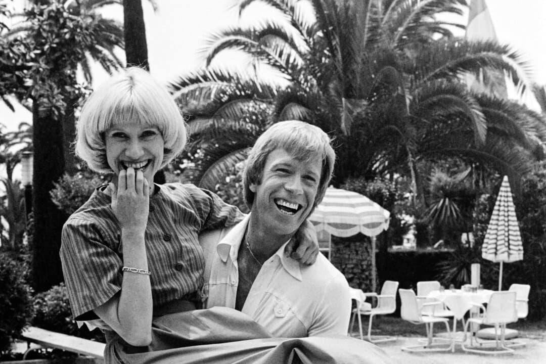 French TV host Daniele Gilbert and U.S. actor Chuck Norris are pictured during the Cannes Film Festival in Cannes, France, in May 1976. (Raph Gatti/AFP via Getty Images)