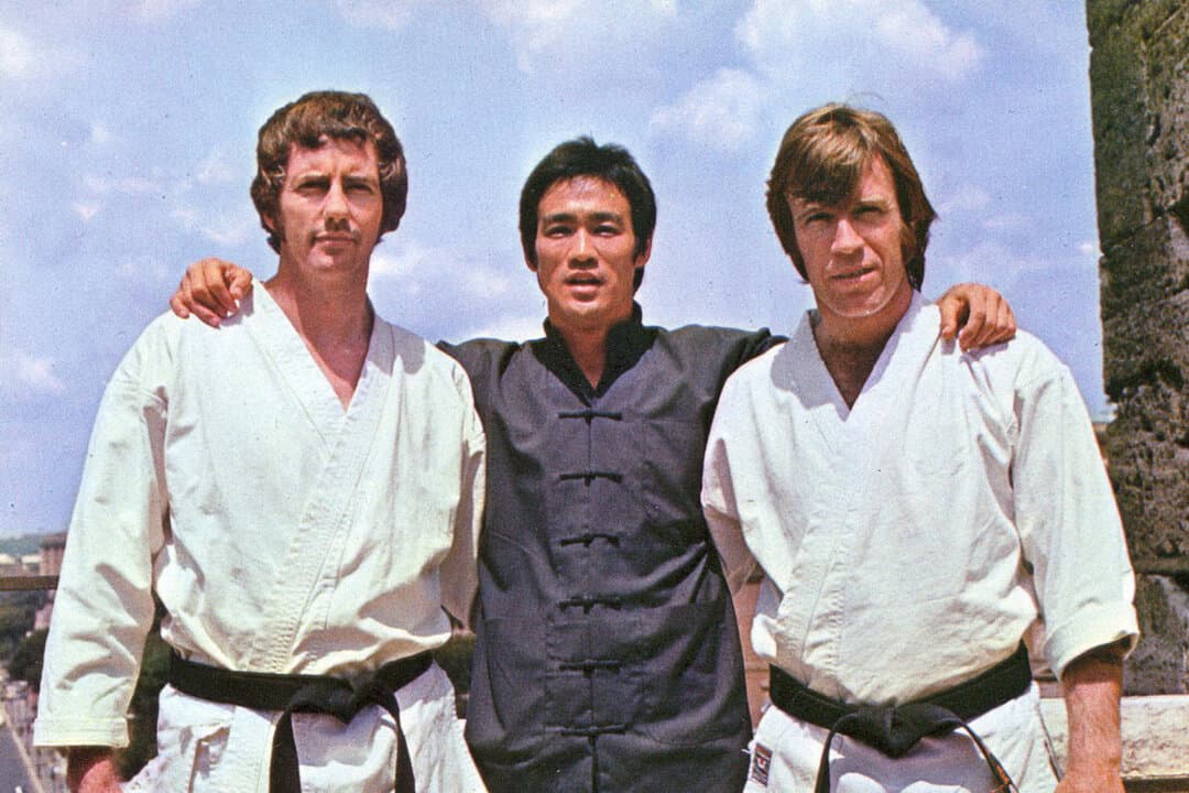 (L-R) Robert Wall, Bruce Lee, and Chuck Norris behind the scenes in “The Way of the Dragon” in 1972. (Golden Harvest Company, Concord Productions)