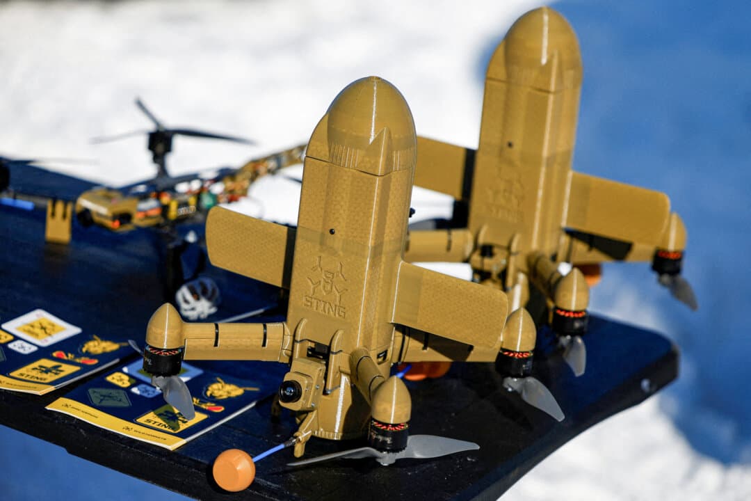 (Left) A STING FPV interceptor drone is displayed at an exhibition in Ukraine on Feb. 20, 2026. A Ukrainian security official said on March 20 that Ukraine had sent equipment and operators to several Gulf Arab states to assist with drone interception during the Iran conflict. (Right) A SkyFall employee carries a P1-Sun FPV interceptor drone before a test flight at a training ground in Ukraine on March 6, 2026. (Valentyn Ogirenko/Reuters/File Photo)