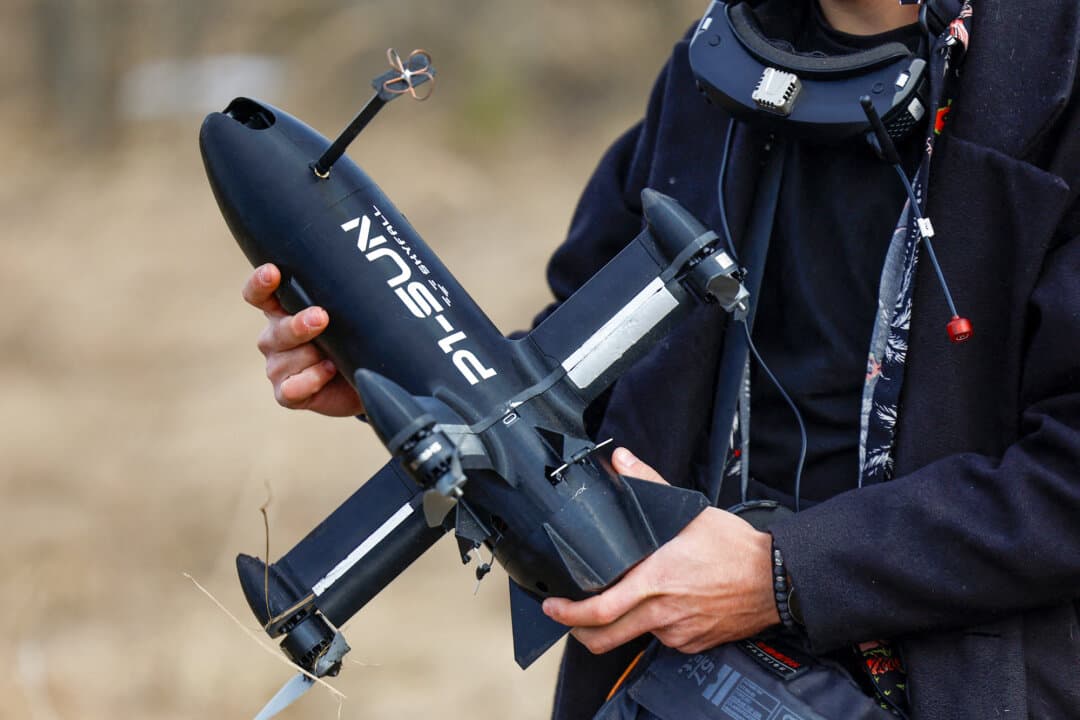 (Left) A STING FPV interceptor drone is displayed at an exhibition in Ukraine on Feb. 20, 2026. A Ukrainian security official said on March 20 that Ukraine had sent equipment and operators to several Gulf Arab states to assist with drone interception during the Iran conflict. (Right) A SkyFall employee carries a P1-Sun FPV interceptor drone before a test flight at a training ground in Ukraine on March 6, 2026. (Valentyn Ogirenko/Reuters/File Photo)