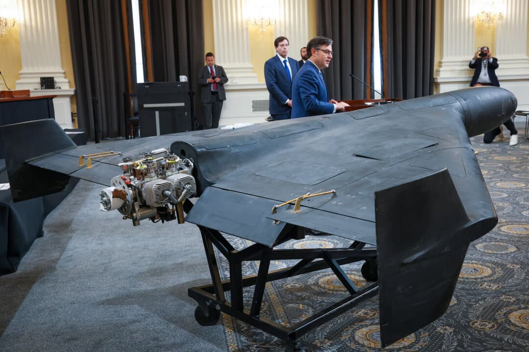 U.S. Speaker of the House Mike Johnson (R-La.) delivers remarks next to a Shahed 136 military drone during a press conference on Capitol Hill in Washington on May 8, 2025. Experts say the low cost and ease of producing one-way attack drones create economic challenges for countering them. (Win McNamee/Getty Images)