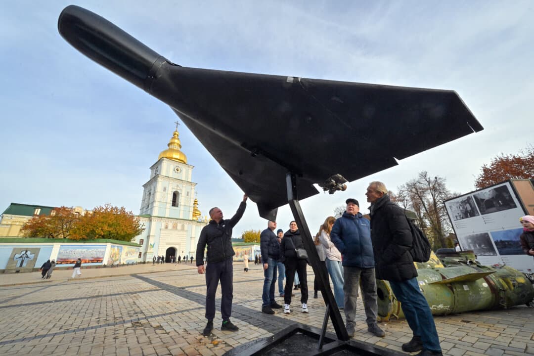 People look at an Iranian-designed Shahed 136 (Geran-2) drone of the Russian Army at an open-air exhibition of destroyed Russian equipment in Kyiv, Ukraine, on Nov. 2, 2025. Without full control of the skies over Ukraine, Russian forces have often used one-way attack drones to hammer Ukrainian cities and critical infrastructure. (Sergei Supinsky/AFP via Getty Images)