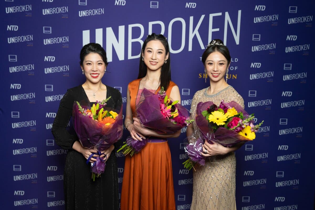 (L–R) Violist Rachel Chen, Shen Yun principal dancer Angela Lin, and former Shen Yun dancer Alison Chen attend the world premiere of "Unbroken: The Untold Story of Shen Yun" at the AMC Lincoln Square movie theater in New York City on March 24, 2026. (Samira Bouaou/The Epoch Times)