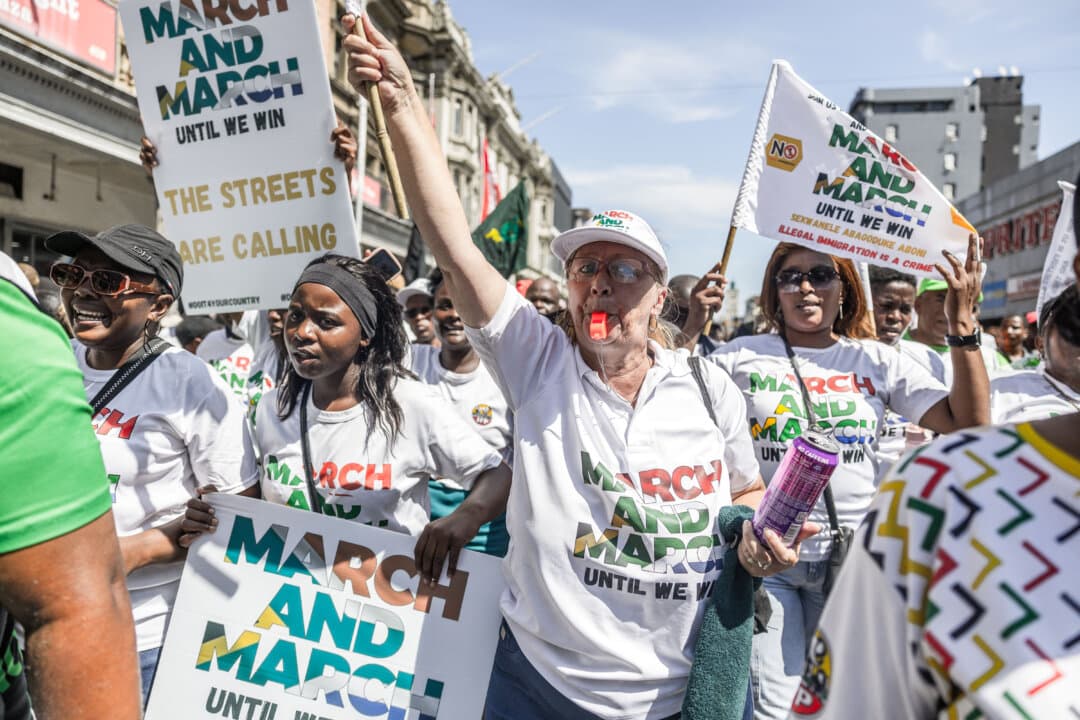 Members of the March and March movement gesture during a protest in Durban, South Africa, on March 25, 2026. The group calls for stronger action against illegal immigration. (Rajesh Jantilal/AFP via Getty Images)