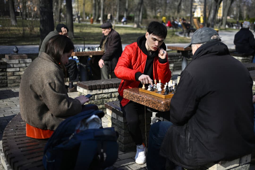 People play chess at a park in central Kyiv, Ukraine, on March 25, 2026. (Genya Savilov/AFP via Getty Images)