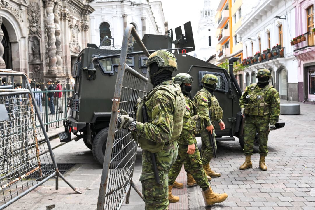 Soldiers stand guard during a visit of special envoy of the U.S. Shield of the Americas Program Kristi Noem outside the Carondelet Palace in Quito, Ecuador, on March 25, 2026. (Rodrigo Buendia/AFP via Getty Images)