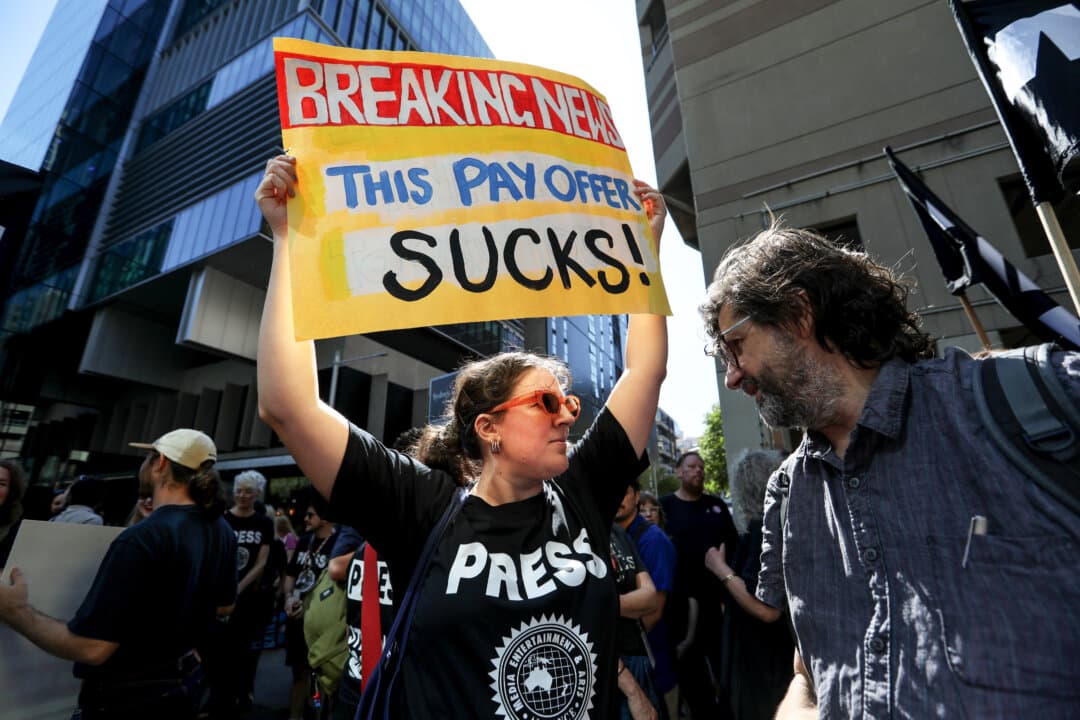 Australian Broadcasting Corporation staff walk off the job during a strike at the ABC headquarters in Ultimo in Sydney, Australia, on March 25, 2026. The industrial action is the first at the national broadcaster in two decades. (Lisa Maree Williams/Getty Images)