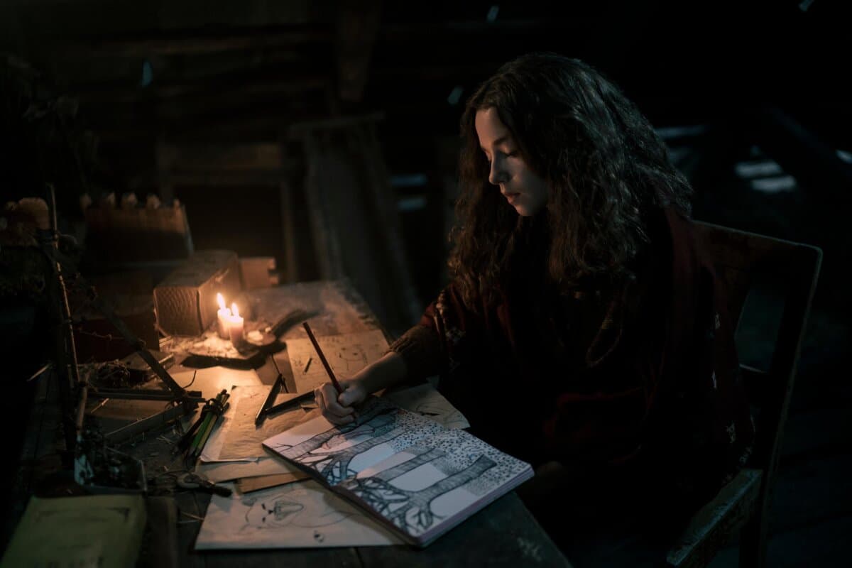 Sara Blum (Ariella Glaser) writes in her scrapbook, in "White Bird." (Lionsgate)
