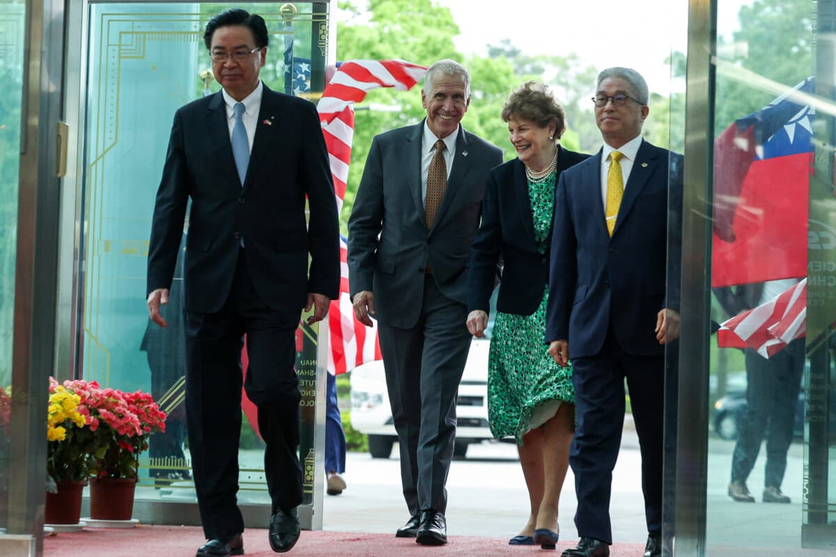 (L–R) Taiwanese Secretary-General of the National Security Council Joseph Wu (L) and U.S. Sens. Thom Tillis (R-N.C.) and Jeanne Shaheen (D-N.H.) arrive at the National Chung-Shan Institute of Science and Technology in Taoyuan, Taiwan, on March 30, 2026. (I-Hwa Cheng/AFP via Getty Images)