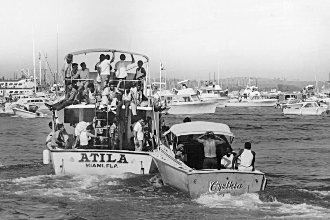 Boats transport Cubans to Miami from the port of Mariel, Cuba, in May 1980. During the Mariel boatlift, a mass exodus that followed a standoff at the Peruvian embassy in Havana, more than 10,000 Cubans sought asylum because of the economic crisis. (Archivo/AFP via Getty Images)