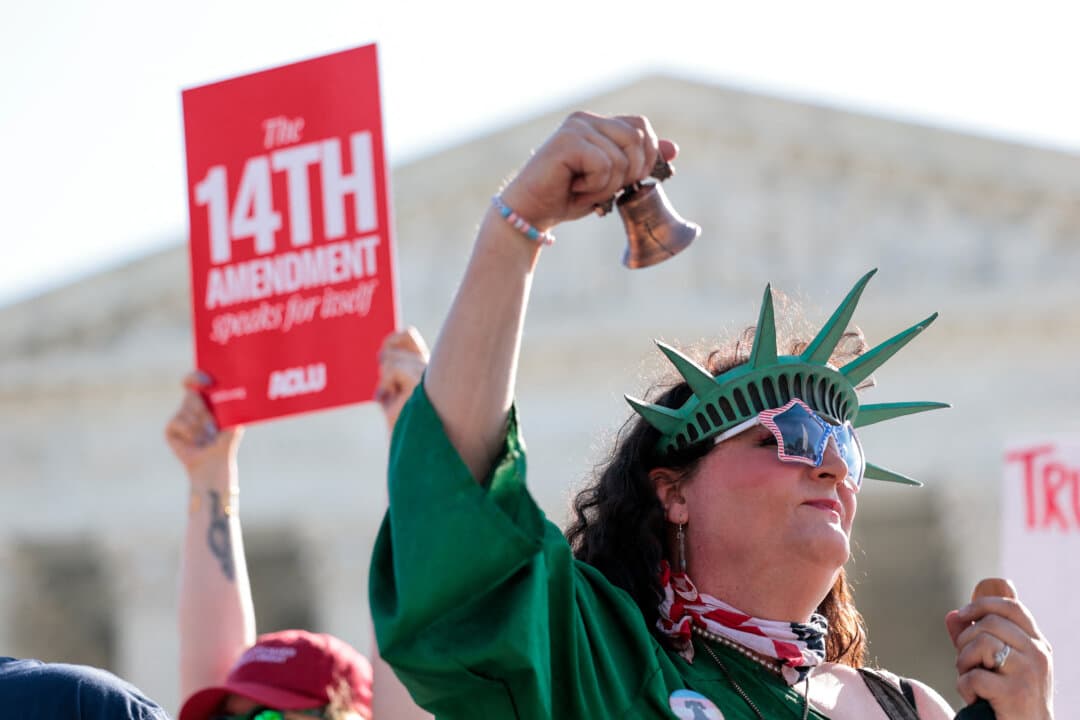 Demonstrators rally outside the U.S. Supreme Court in Washington as President Donald Trump attends oral arguments on birthright citizenship on April 1, 2026. (Kent Nishimura/AFP via Getty Images)