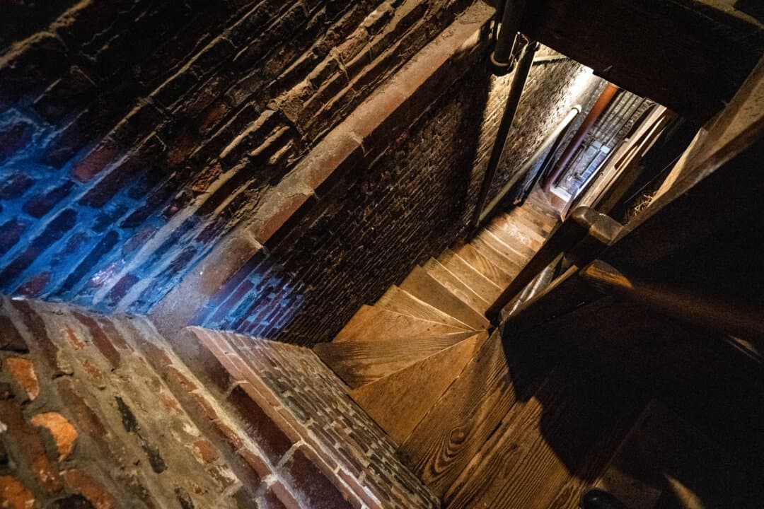 (Top) The bell ringing chamber in Old North Church in Boston on April 8, 2026. (Bottom) The stairs from the bell ringing chamber in Old North Church in Boston on April 8, 2026. (Samira Bouaou/The Epoch Times)
