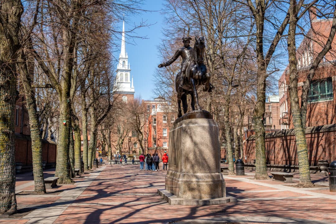 A statue of Paul Revere stands near Old North Church in Boston on April 8, 2026. The church gained national attention for its role in the Revolution after the 1860 publication of Henry Wadsworth Longfellow’s poem, “Paul Revere’s Ride.” (Samira Bouaou/The Epoch Times)
