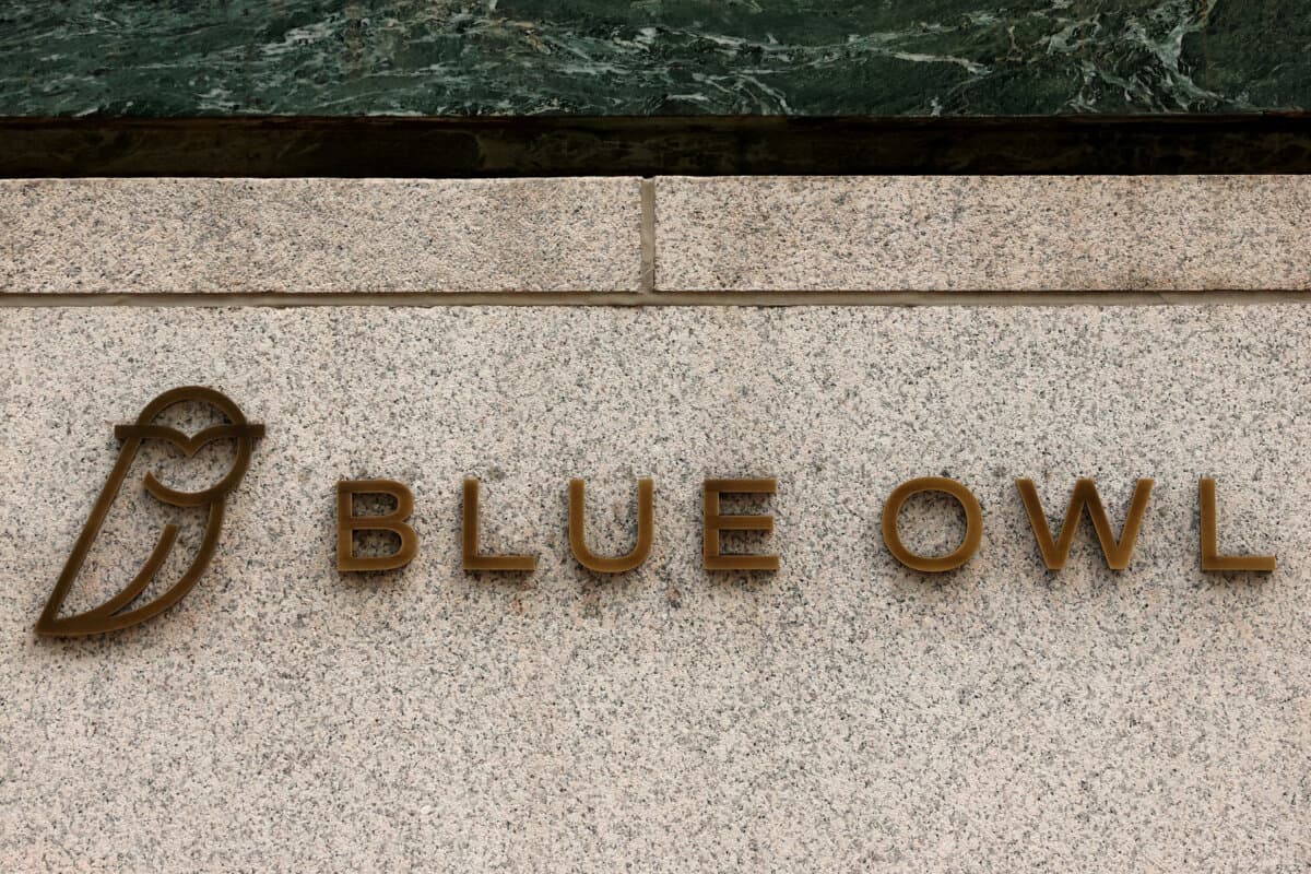 A logo for Blue Owl Capital is displayed on a midtown Manhattan office building in New York City on Feb. 24, 2026. (Brendan McDermid/Reuters)
