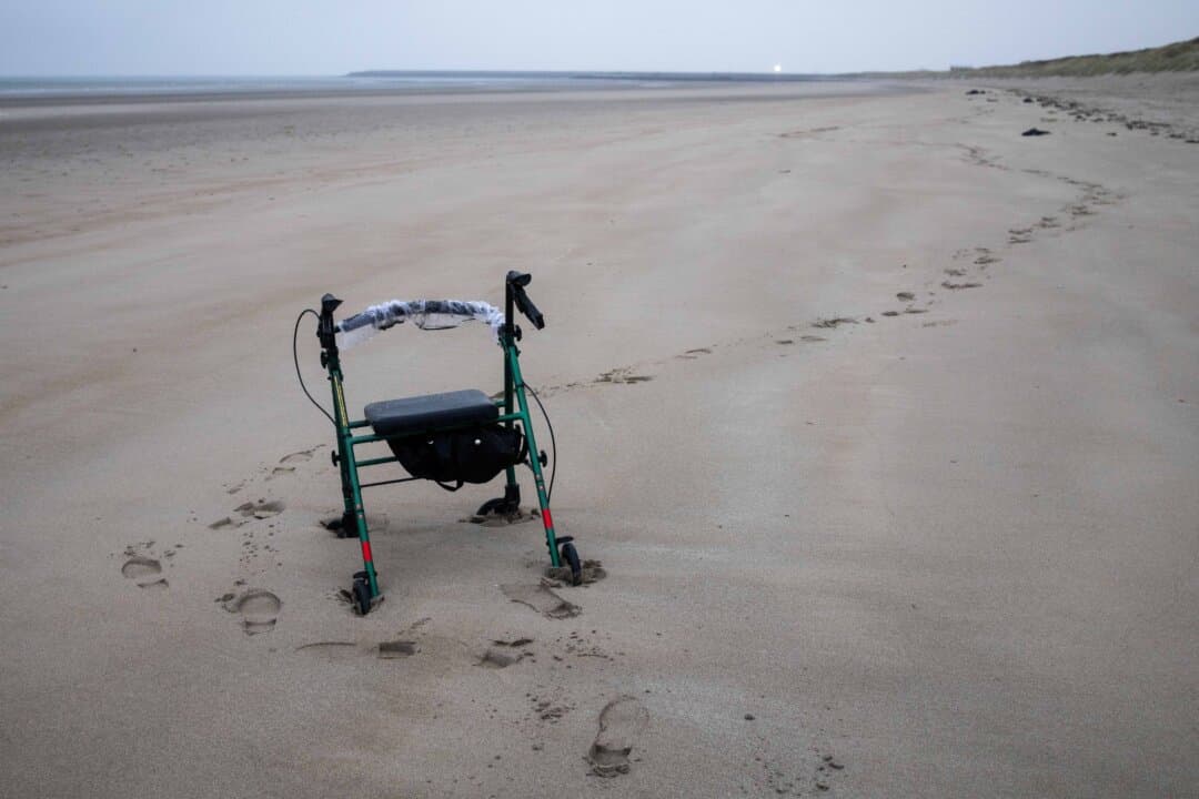 A mobility aid is left on Gravelines Beach in Gravelines, France, on April 2, 2026. The day before, five migrants were pulled from the water there; two men in their 40s died and three needed medical treatment. The tragedy comes as the UK and France have extended negotiations to continue a deal for UK funding for French beach patrols. (Tom Nicholson/Getty Images)