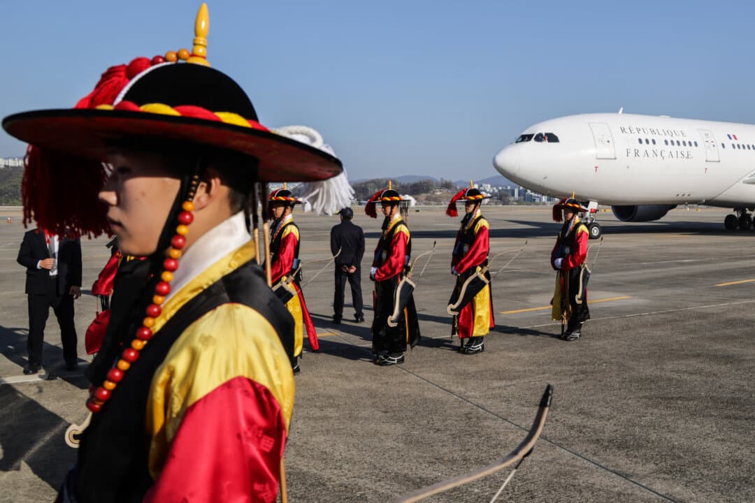 South Korean honor guards prepare to welcome French President Emmanuel Macron at Seoul Air Base in Seongnam, South Korea, on April 2, 2026. (Ludovic Marin/POOL/AFP via Getty Images)
