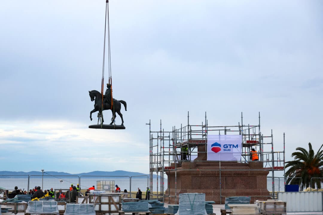 Workers with a crane lift a statue representing Napoleon I on a horse to place it back on its pedestal facing the sea as part of the renovation of the Charles de Gaulle Square in Ajaccio, on the French Mediterranean island of Corsica on April 2, 2026. (Pascal Pochard-Casabianca/AFP via Getty Images)