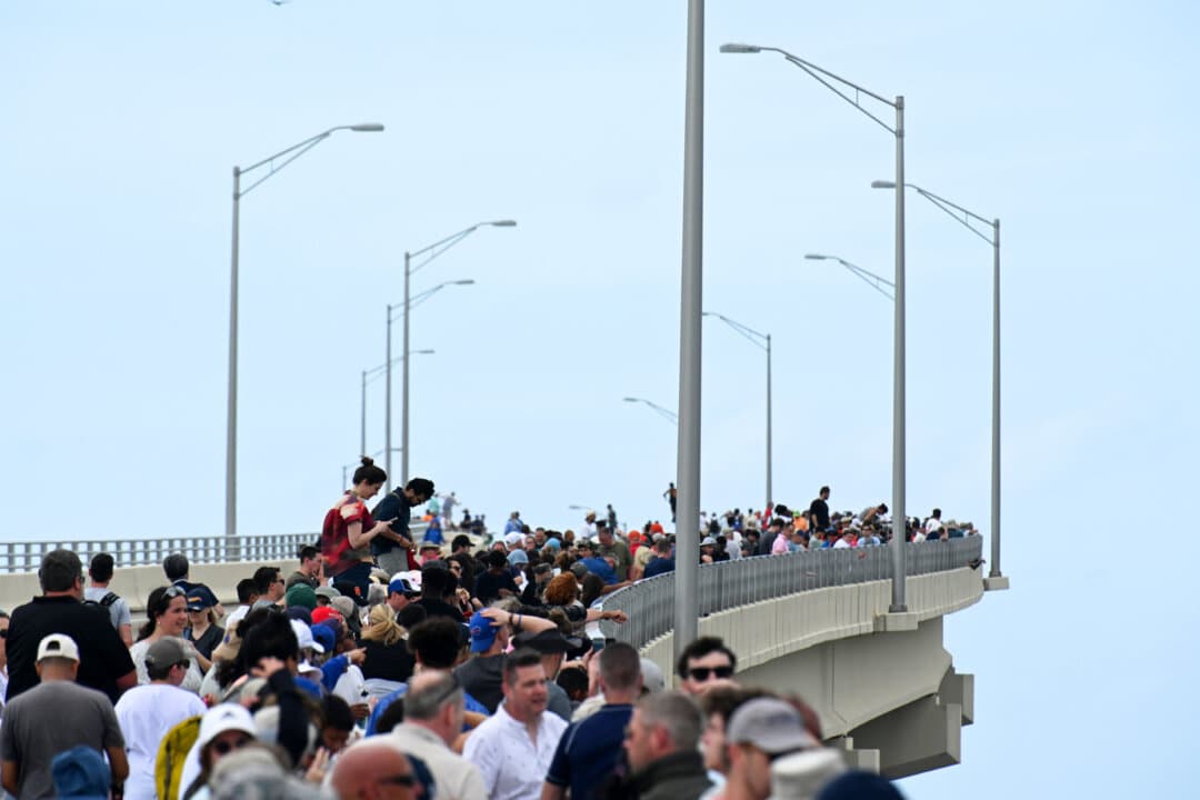 People gather to watch the launch of Artemis II from the A. Max Brewer Bridge in Titusville, Fla., on April 1, 2026. (Gerardo Mora/Getty Images)