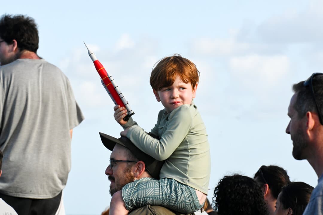 People gather to watch the launch of Artemis II from the A. Max Brewer Bridge in Titusville, Fla., on April 1, 2026. (Gerardo Mora/Getty Images)
