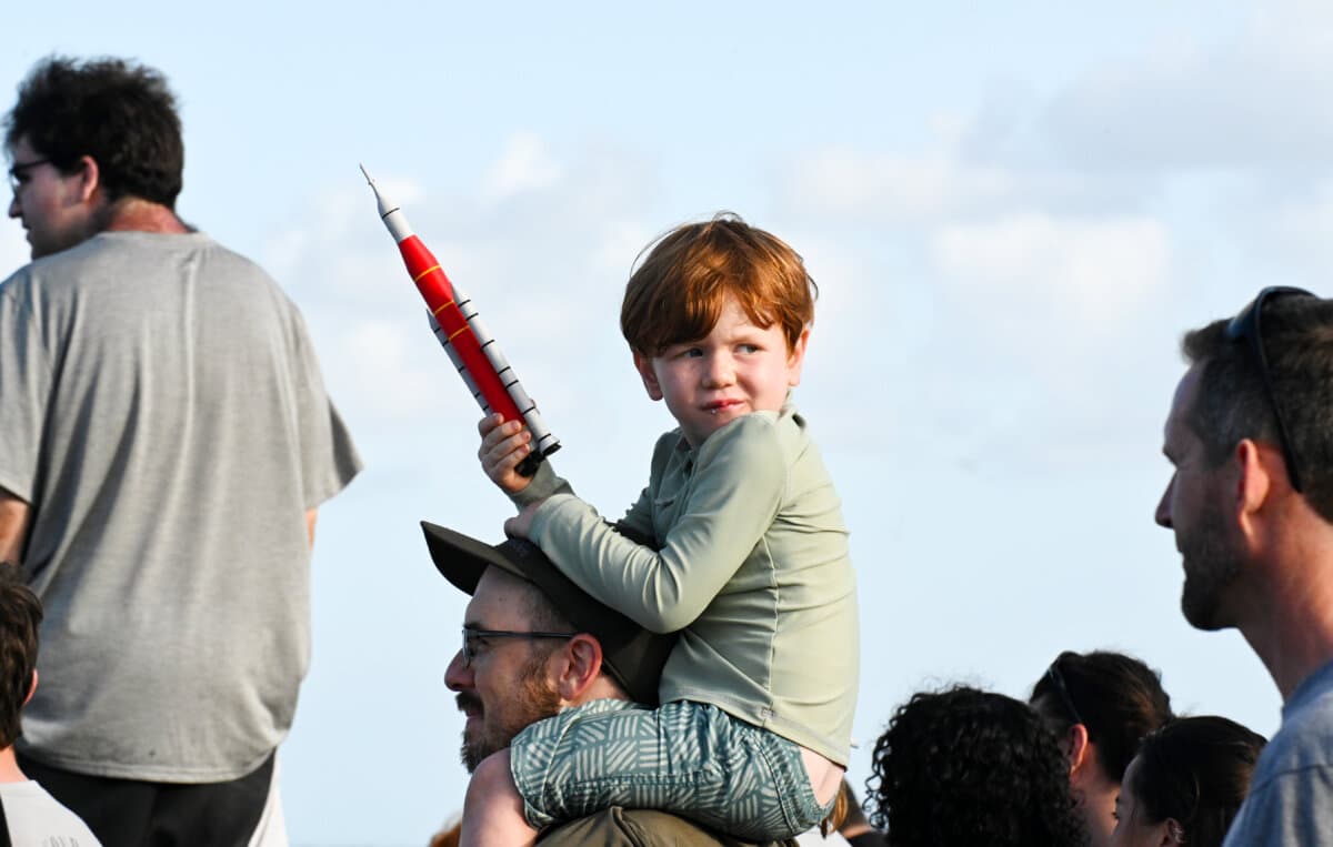 People gather to watch the launch of Artemis II from the A. Max Brewer Bridge in Titusville, Fla., on April 1, 2026. (Gerardo Mora/Getty Images)