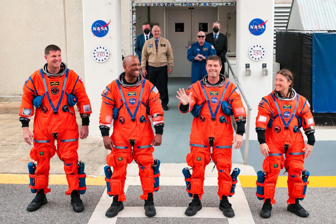 (L-R) Mission Specialist Jeremy Hansen of the Canadian Space Agency, pilot Victor Glover, commander Reid Wiseman, and mission specialist Christina Koch walk out of the Neil A. Armstrong Operations and Checkout Building ahead of the launch of the Artemis II at NASA’s Kennedy Space Center in Cape Canaveral, Fla., on April 1, 2026. (Chip Somodevilla/Getty Images)