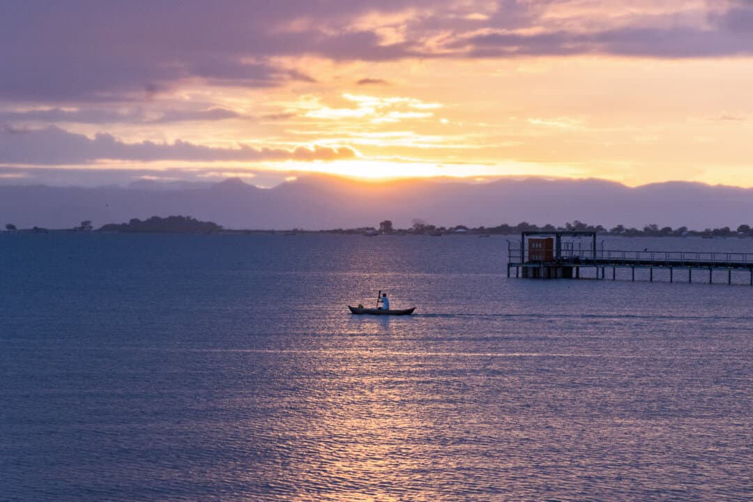 A fisherman paddles his boat on Lake Malawi, Africa, on Feb. 20, 2026. (John Fredricks/The Epoch Times)