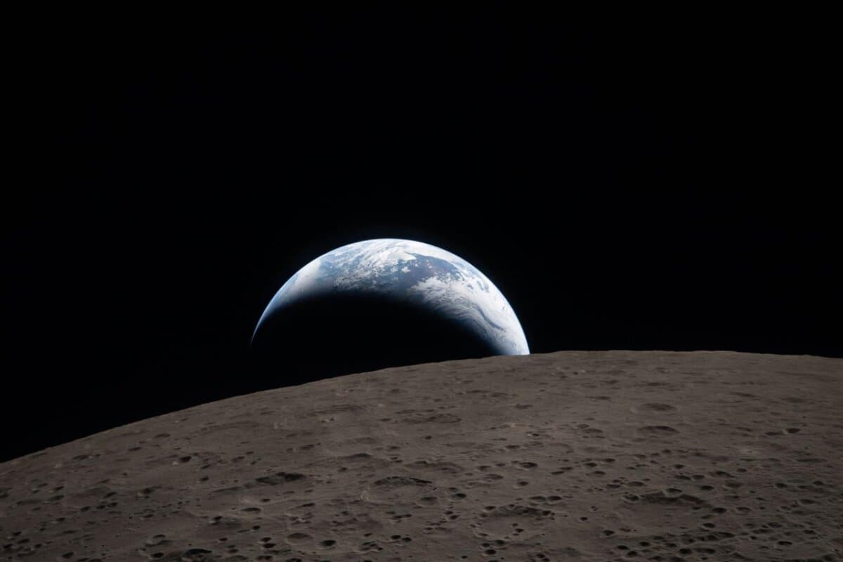 Earthset captured through the Orion spacecraft window at 6:41 p.m. ET on April 6, 2026, during the Artemis II crew’s flyby of the Moon. (Courtesy of NASA)