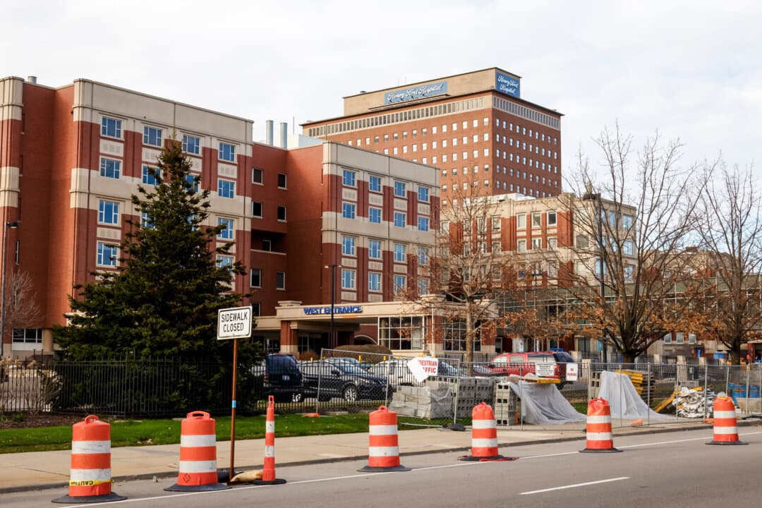 A view of the entrance to Henry Ford Hospital in Detroit on April 8, 2020. A spokesperson for the hospital, a 340B-covered entity with nearly 500 affiliated sites, told The Epoch Times that the program helps nonprofit systems ensure patients can access needed care. (Elaine Cromie/Getty Images)