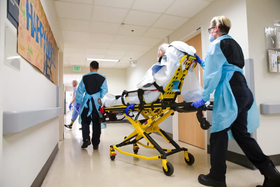 A patient is transferred to Harborview Medical Center in Seattle on May 6, 2020. A 2024 study published in the New England Journal of Medicine found that the hospitals participating in the 340B program sold infusion medications for between two and six times what they paid for them. (Karen Ducey/Getty Images)
