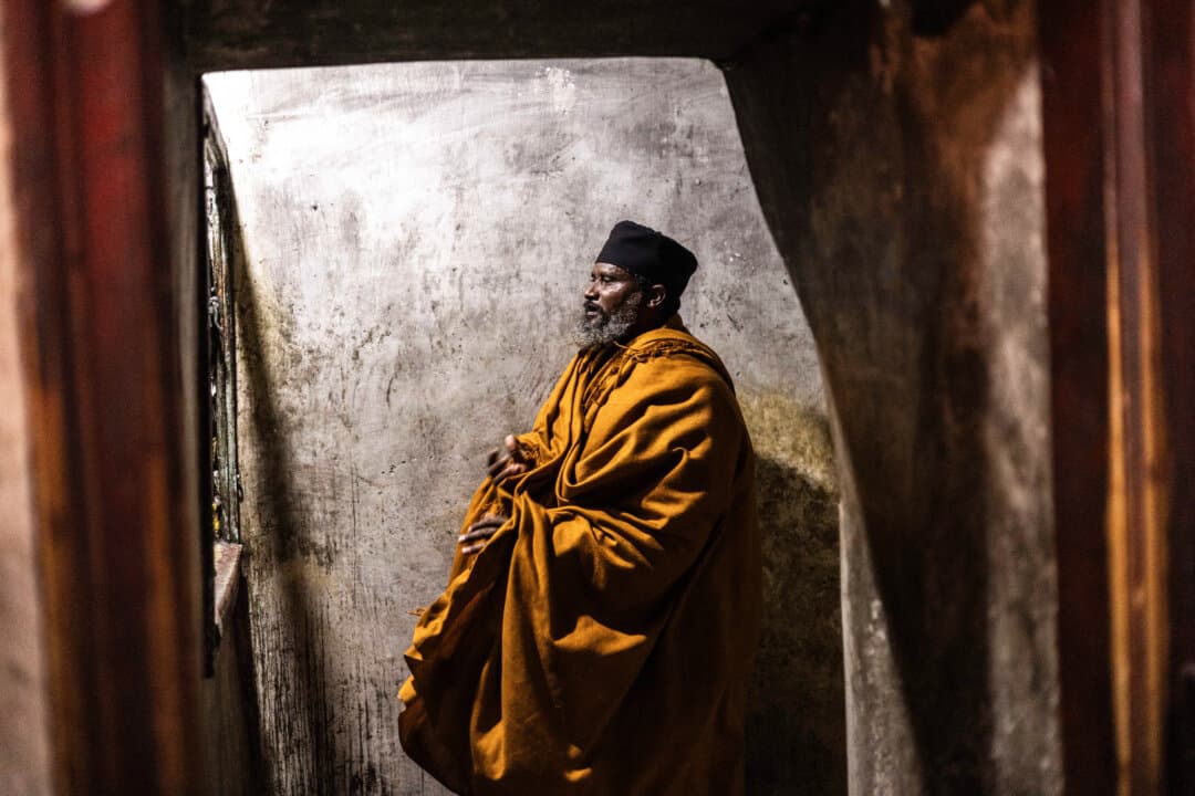 A man at the Church of the Holy Sepulchre in the old city of Jerusalem on April 9, 2026. (John Wessels/AFP via Getty Images)