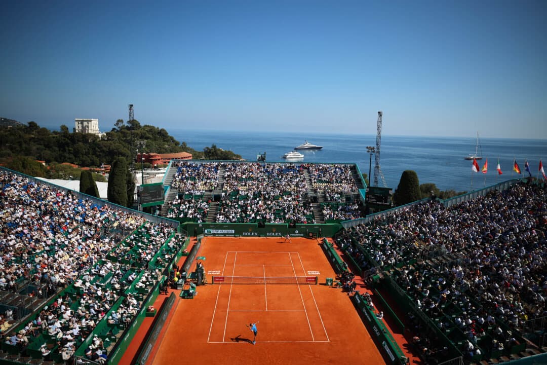 Spain's Carlos Alcaraz serves to Argentina's Tomas Martin Etcheverry during their Monte Carlo ATP Masters Series Tournament round of 16 tennis match on Court Rainier III at the Monte-Carlo Country Club in Roquebrune-Cap-Martin, France, on April 9, 2026. (Valery Hache/AFP via Getty Images)